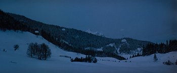 Movie still from “Where Eagles Dare” (1968), directed by Brian G. Hutton – A view of a snowy mountain at night time; Extreme Wide shot, Low angle