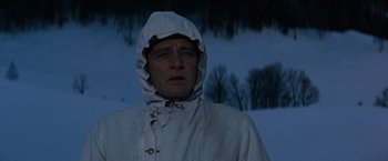 Movie still from “Where Eagles Dare” (1968), directed by Brian G. Hutton – A man wearing a white coat and a white hat; Close Up shot, Low angle