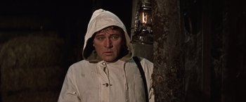 Movie still from “Where Eagles Dare” (1968), directed by Brian G. Hutton – A man in a white jacket and a lantern; Close Up shot, Low angle