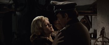 Movie still from “Where Eagles Dare” (1968), directed by Brian G. Hutton – A man and a woman are looking into each others eyes; Close Up shot, Low angle