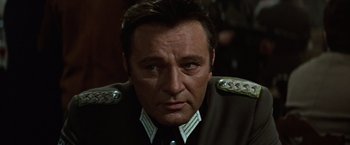 Movie still from “Where Eagles Dare” (1968), directed by Brian G. Hutton – A person wearing a uniform; Close Up shot, Over the shoulder angle