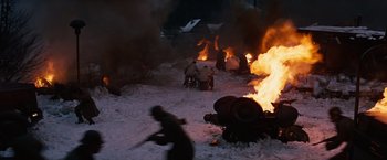 Movie still from “Where Eagles Dare” (1968), directed by Brian G. Hutton – A group of people in the snow near a fire; Extreme Wide shot, High angle