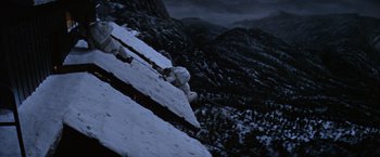 Movie still from “Where Eagles Dare” (1968), directed by Brian G. Hutton – A person standing on top of a snow covered slope; Extreme Wide shot, Overhead angle