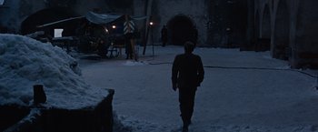 Movie still from “Where Eagles Dare” (1968), directed by Brian G. Hutton – A man walking in the snow at night; Extreme Wide shot, High angle