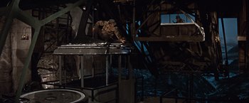 Movie still from “Where Eagles Dare” (1968), directed by Brian G. Hutton – A man in a helmet is standing on a metal structure; Wide shot, High angle