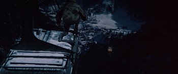 Movie still from “Where Eagles Dare” (1968), directed by Brian G. Hutton – A man standing on top of a ski slope; Wide shot, High angle