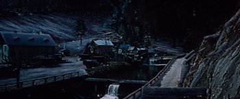 Movie still from “Where Eagles Dare” (1968), directed by Brian G. Hutton – A dark picture of a river and some buildings; Extreme Wide shot, High angle