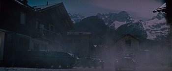 Movie still from “Where Eagles Dare” (1968), directed by Brian G. Hutton – A group of people standing in front of a building; Extreme Wide shot, Low angle