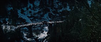 Movie still from “Where Eagles Dare” (1968), directed by Brian G. Hutton – A view of a bridge over a body of water; Extreme Wide shot, High angle