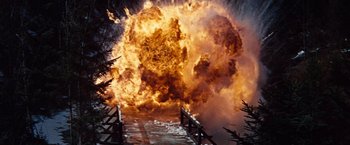 Movie still from “Where Eagles Dare” (1968), directed by Brian G. Hutton – An explosion is coming out of a bridge; Wide shot, Low angle