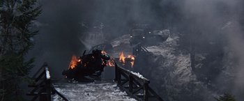 Movie still from “Where Eagles Dare” (1968), directed by Brian G. Hutton – A fire is burning in a mountainous area; Extreme Wide shot, High angle