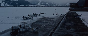 Movie still from “Where Eagles Dare” (1968), directed by Brian G. Hutton – A group of airplanes sitting on top of a snow covered ground; Extreme Wide shot, High angle