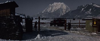 Movie still from “Where Eagles Dare” (1968), directed by Brian G. Hutton – A group of people standing in front of a truck in the snow; Extreme Wide shot, Low angle