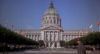 Movie still from “Where the Buffalo Roam” (1980), directed by Art Linson – A very large building with a very tall dome; Extreme Wide shot, High angle
