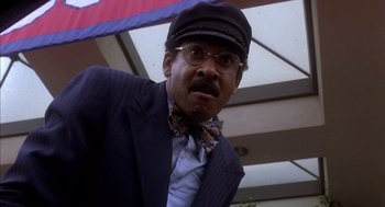 Movie still from “Where the Buffalo Roam” (1980), directed by Art Linson – An older man wearing a bow tie and a hat; Close Up shot, Low angle