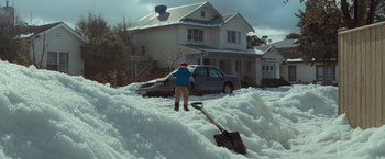 Movie still from “Where the Wild Things Are” (2009), directed by Spike Jonze – A person standing in the snow with a shovel; Extreme Wide shot, High angle