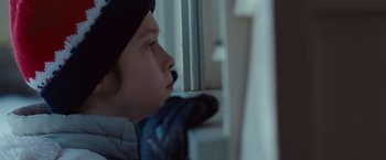 Movie still from “Where the Wild Things Are” (2009), directed by Spike Jonze – A young boy looking out of a window; Close Up shot, Over the shoulder angle
