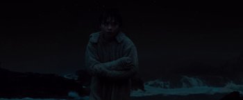 Movie still from “Where the Wild Things Are” (2009), directed by Spike Jonze – A man standing in the dark with his arms crossed; Medium shot, Low angle