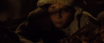 Movie still from “Where the Wild Things Are” (2009), directed by Spike Jonze – A young woman wearing a hooded jacket looking at the camera; Close Up shot, High angle