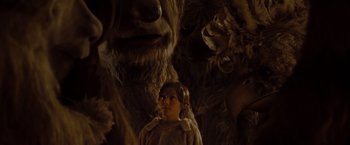 Movie still from “Where the Wild Things Are” (2009), directed by Spike Jonze – A young girl standing in front of a group of furry creatures; Close Up shot, Low angle
