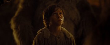 Movie still from “Where the Wild Things Are” (2009), directed by Spike Jonze – A young boy wearing a fur coat looking up; Close Up shot, Low angle