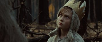 Movie still from “Where the Wild Things Are” (2009), directed by Spike Jonze – A young boy wearing a paper hat in the woods; Close Up shot, Low angle