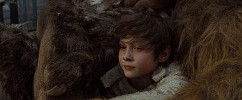 Movie still from “Where the Wild Things Are” (2009), directed by Spike Jonze – A young boy is sitting in a pile of fur; Close Up shot, Low angle