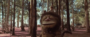 Movie still from “Where the Wild Things Are” (2009), directed by Spike Jonze – A boy riding on the back of a stuffed animal; Wide shot, Low angle