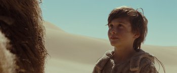 Movie still from “Where the Wild Things Are” (2009), directed by Spike Jonze – A young boy standing on top of a sand dune; Close Up shot, Low angle