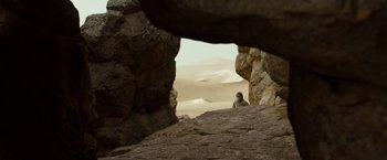 Movie still from “Where the Wild Things Are” (2009), directed by Spike Jonze – A person sitting on top of a rock formation; Extreme Wide shot, Low angle