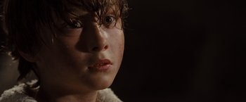 Movie still from “Where the Wild Things Are” (2009), directed by Spike Jonze – A young boy's face in the dark; Close Up shot, High angle