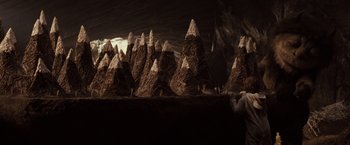 Movie still from “Where the Wild Things Are” (2009), directed by Spike Jonze – A group of mountains that are made out of chocolate; Extreme Wide shot, High angle