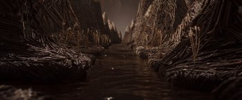 Movie still from “Where the Wild Things Are” (2009), directed by Spike Jonze – A river running through a valley filled with rocks; Extreme Wide shot, High angle