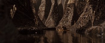 Movie still from “Where the Wild Things Are” (2009), directed by Spike Jonze – A boat in the water near some trees; Extreme Wide shot, High angle