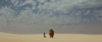 Movie still from “Where the Wild Things Are” (2009), directed by Spike Jonze – A man and a stuffed animal in the middle of the desert; Extreme Wide shot, Low angle