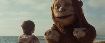 Movie still from “Where the Wild Things Are” (2009), directed by Spike Jonze – A person holding an owl in their hands; Medium shot, Low angle