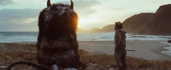 Movie still from “Where the Wild Things Are” (2009), directed by Spike Jonze – An animal that is sitting in the grass; Extreme Wide shot, Low angle