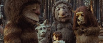 Movie still from “Where the Wild Things Are” (2009), directed by Spike Jonze – A group of people in the woods with a child; Wide shot, Over the shoulder angle