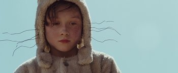 Movie still from “Where the Wild Things Are” (2009), directed by Spike Jonze – A young girl wearing an animal print coat; Close Up shot, Low angle