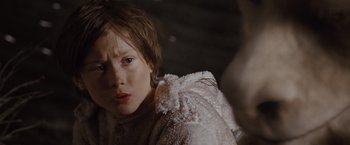 Movie still from “Where the Wild Things Are” (2009), directed by Spike Jonze – A young child wearing a white coat looking at the camera; Close Up shot, Over the shoulder angle