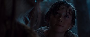 Movie still from “Where the Wild Things Are” (2009), directed by Spike Jonze – A young person with wet hair looking into the camera; Close Up shot, Over the shoulder angle