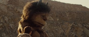 Movie still from “Where the Wild Things Are” (2009), directed by Spike Jonze – A young boy is standing next to an animal costume; Close Up shot, Low angle