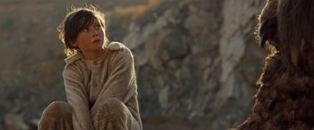 Movie still from “Where the Wild Things Are” (2009), directed by Spike Jonze – A young girl sitting on the ground wearing a fur coat; Close Up shot, Low angle