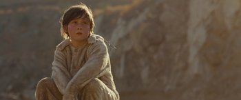 Movie still from “Where the Wild Things Are” (2009), directed by Spike Jonze – A young boy sitting on the ground wearing a blanket; Close Up shot, Low angle