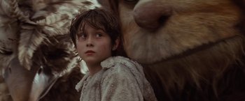 Movie still from “Where the Wild Things Are” (2009), directed by Spike Jonze – A young boy standing in front of a stuffed animal; Close Up shot, Low angle