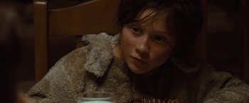 Movie still from “Where the Wild Things Are” (2009), directed by Spike Jonze – A young girl is sitting on a bed with a candle in her hand; Close Up shot, High angle
