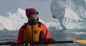 Movie still from “Where'd You Go, Bernadette” (2019), directed by Richard Linklater – A woman is holding a paddle in a boat; Medium shot, Low angle