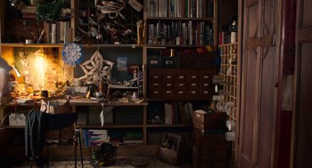 Movie still from “Where'd You Go, Bernadette” (2019), directed by Richard Linklater – A cluttered room filled with lots of books and papers; Wide shot, Overhead angle