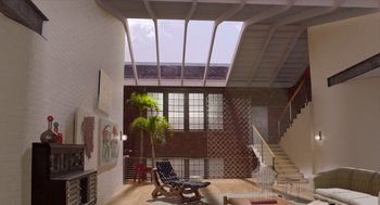 Movie still from “Where'd You Go, Bernadette” (2019), directed by Richard Linklater – A room filled with lots of furniture and a large skylight; Extreme Wide shot, High angle