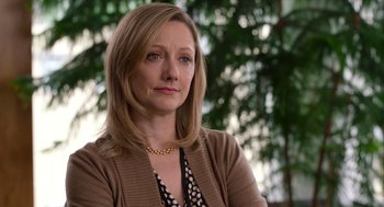 Movie still from “Where'd You Go, Bernadette” (2019), directed by Richard Linklater – A person wearing a necklace; Close Up shot, Over the shoulder angle